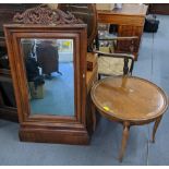 A Victorian walnut mirror having a carved pediment and bevelled glass 116h x64w together with an
