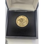 United States of America - A 1976 bicentennial gold piece depicting eagle to reverse, George