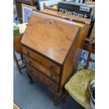 An early 20th century Queen Anne style bureau 98h x 55.5w together with a riding crop Location: