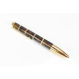 A Montblanc Miguel de Cervantes writers series ballpoint pen, with brown marbled lacquer body and