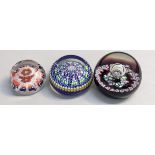 Three paperweights to include a Perthshire millefiori paperweight Location: