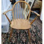 A mid 20th century Ercol Windsor elm and beech hoop back armchair Location: