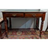 An early 20th century mahogany desk with a green leather topped scriber with side stretchers, raised