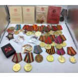 A collection of Replica USSR/CCCP medals to include Red Army WWII 50th Anniversary, Order of the Red