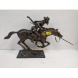 A cast bronze model depicting a Mongolian Normad warrior on horseback armed with a gun, sword and