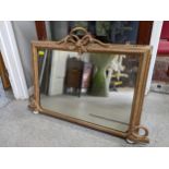 A gilt framed overmantle mirror with rope and bow decoration rectangular plate glass 67 x 97 cms