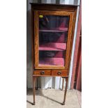An Edwardian mahogany display cabinet having a single glazed door above two drawers, 156cm h x