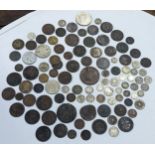 A mixed collection of world coins to include William and Mary halfpenny, 1822 Irish halfpenny,