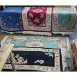 Five mixed Chinese rugs in blue, red, green and black with floral designs Location: