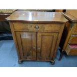 A late 19th early 20th century French walnut cabinet having mother of pearl escutcheons and a