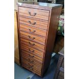 A reproduction mahogany tall chest of ten drawers with swan neck handles 130cm h x 50.5cm w