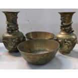 A pair of Chinese bronze dragon vases decorated in relief, 24cm h and two engraved bowls Location: