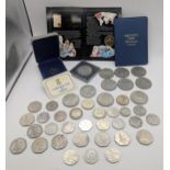 A collection of mixed British coins to include three 2022 Charles III 50ps, mixed 50p to include
