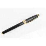 A Montblanc Meisterstuck Pix rollerball pen, in black lacquer and gilt, the tip of the cap with