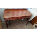 A Victorian mahogany side table having two drawers and on reeded legs Location: