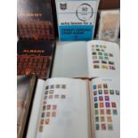 Three partially filled stamp albums containing Worldwide stamps to include China and GB together