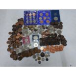 A mixed collection of mostly British coins to include Victorian and later pennies, an 1896 shilling,