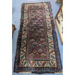 A hand woven Turkish rug having repeating motifs and multiguard borders, 235 x 106, Location: