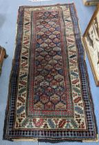 A hand woven Turkish rug having repeating motifs and multiguard borders, 235 x 106, Location: