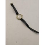A Waltham 14ct gold ladies manual wind wristwatch on a black leather strap Location:CAB 7