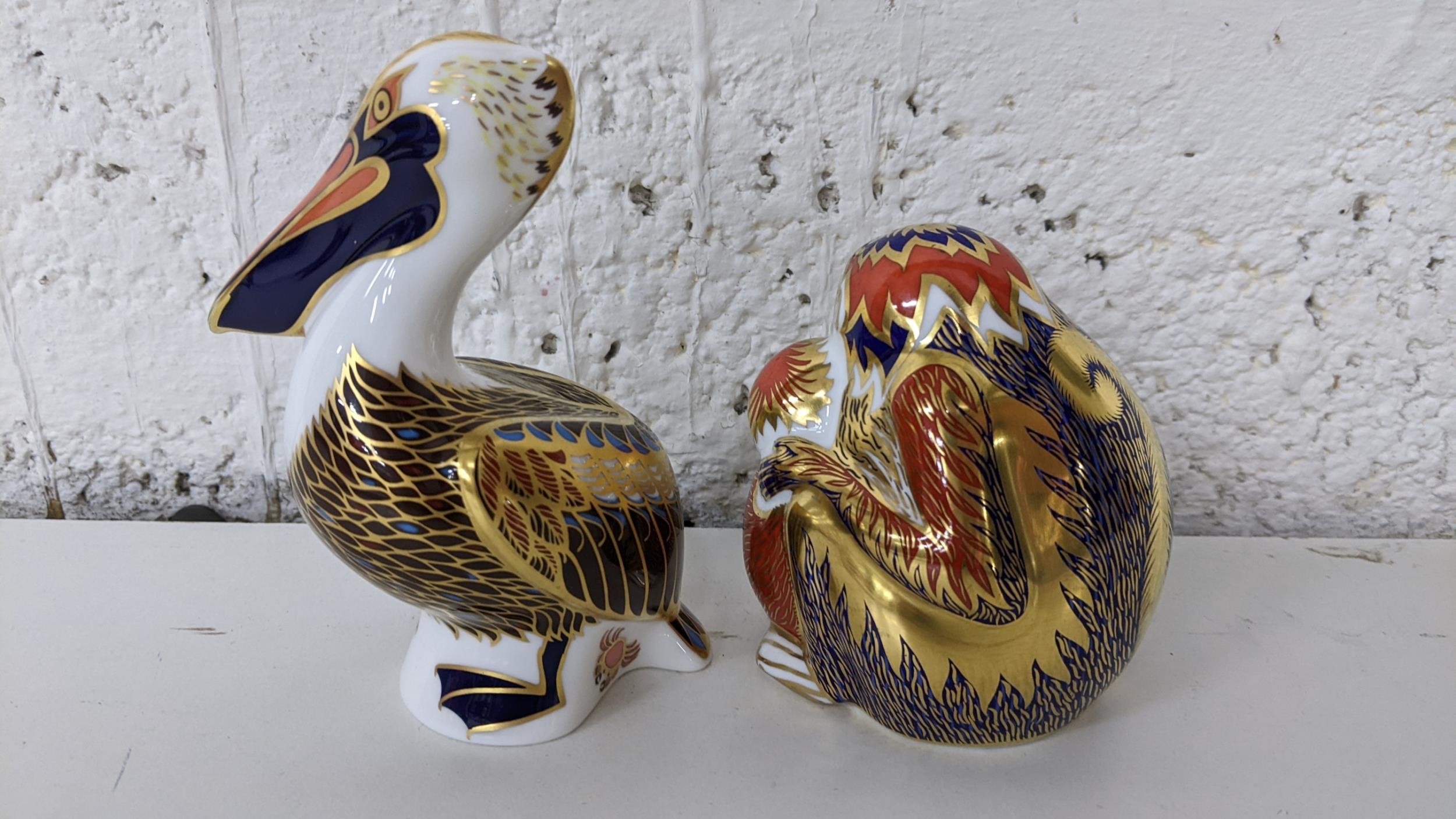 A Royal Crown Derby Pelican paperweight with gold stopper, together with two monkey paperweights - Image 2 of 3