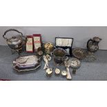 A collection of silver plated items to include spirit kettle, cutlery, hot water pot, wine holder,