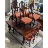 A Victorian mahogany wind out dinning table on bulbous turned legs and large brass casters 74cm x