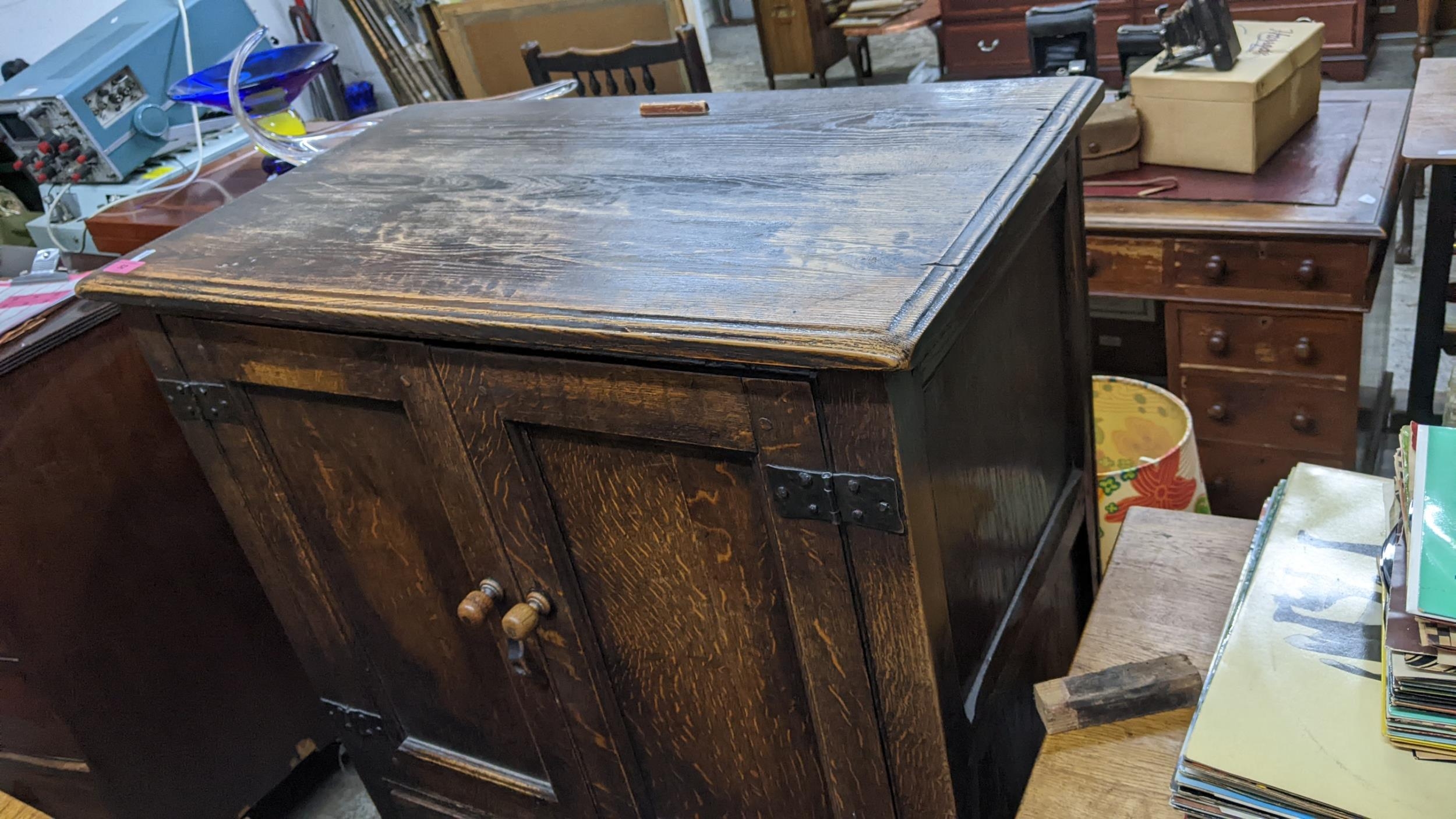An early 20th century oak cabinet with twin panelled doors, over three drawers, 125H x 81w, - Image 2 of 2
