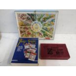 A group of three jigsaw puzzles in original boxes to include one depicting the coloured pages The