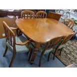 A John Lewis oak extending dining table with extra leaf and a set of six matching dining chairs,