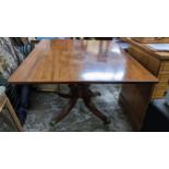 An early 19th century mahogany breakfast table on four fluted, splayed legs, 72.5h x 120.5w,