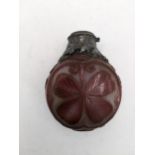A 19th century cameo glass scent bottle with white metal collar, decorated with a four leaf clover