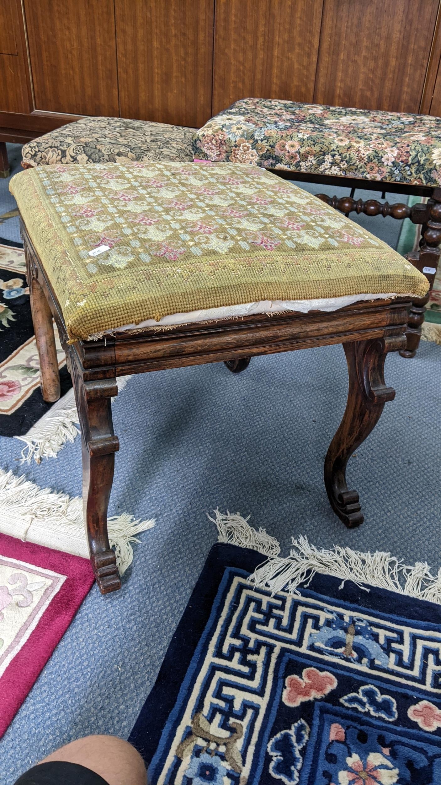 A 19th century tapestry topped footstool having a carved C-scroll frame and on cabriole legs, - Image 2 of 3