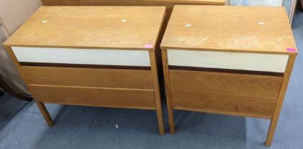 Two Richard Young for G-Plan chests of drawers having white painted top drawers and squared legs,