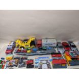A quantity of model diecast vehicles and other toys to include a Tomy Roadway set, Esso Garage