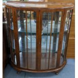 A mid 20th century walnut bow fronted display cabinet on short cabriole legs, 117h x 106w, Location: