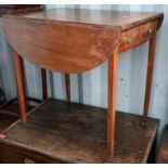 An early 19th century mahogany Pembroke table having single drawer and on tapering legs, 74.5cm h