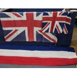 Three vintage Union Jack flags, the larger one 162cm x 112cm along with two smaller ones 62 x 80