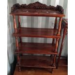 A reproduction mahogany four tier bookcase with a carved gallery, 117.5cm h x 70cm w Location: