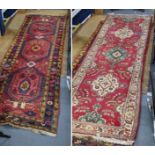 Two runners to include a red ground Turkish with geometric design, 318cm x 107cm, the other 338cm