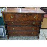 A 19th century French walnut chest of four long drawers having ring handles and twin lacquered