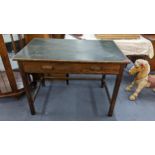 A 1940s oak desk having a green leather top and two inset drawers, Location: