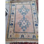 An Tajikistan style cream ground rug Location: