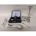 A mixed selection of silver items to include a cased child's christening eggcup and spoon,