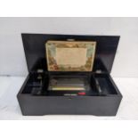 A late 19th century grained wooden cased ten air musical box Location: