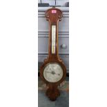 A Victorian walnut barometer, the silvered dial signed P Pedrini, 90.5h Location: