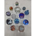 A collection of mixed paperweights to include nine Caithness examples to include collectors editions