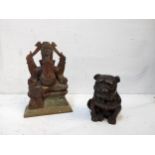 An early 20th century small bronze model of a seated bulldog, along with a carved onyx sculpture