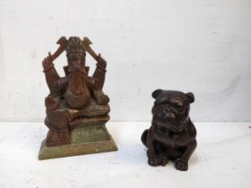 An early 20th century small bronze model of a seated bulldog, along with a carved onyx sculpture