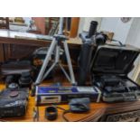 A selection of film cameras, lens, and accessories to include a Minolta 7000 with zoom lens 70-